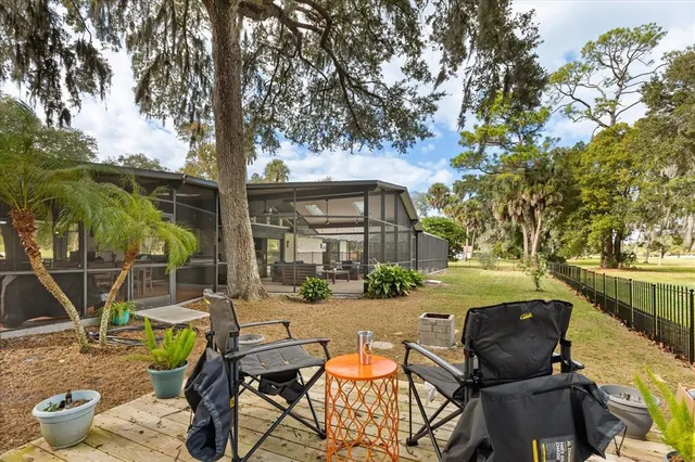 a view of yard with swimming pool and green space