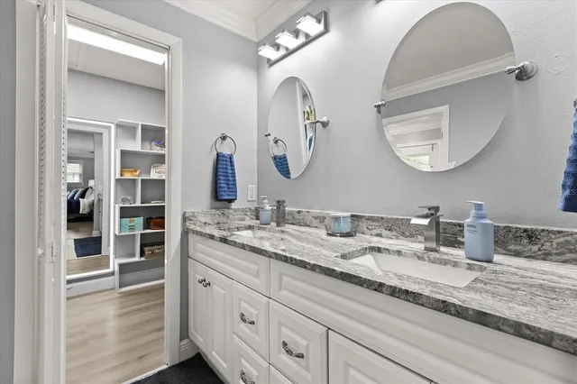 a bathroom with a toilet a sink and a window