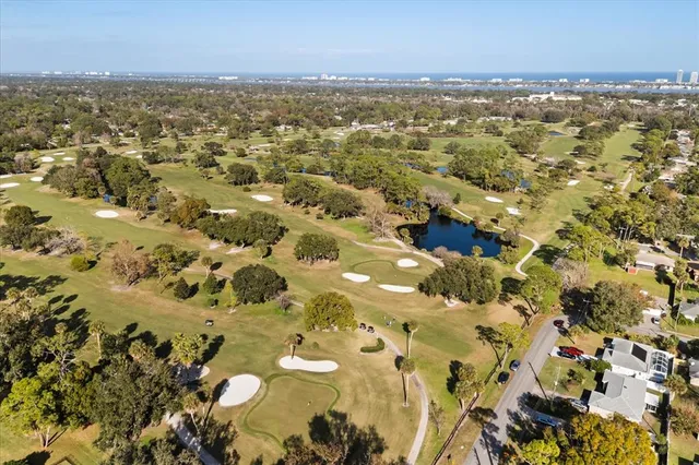 a house with swimming pool in front of it