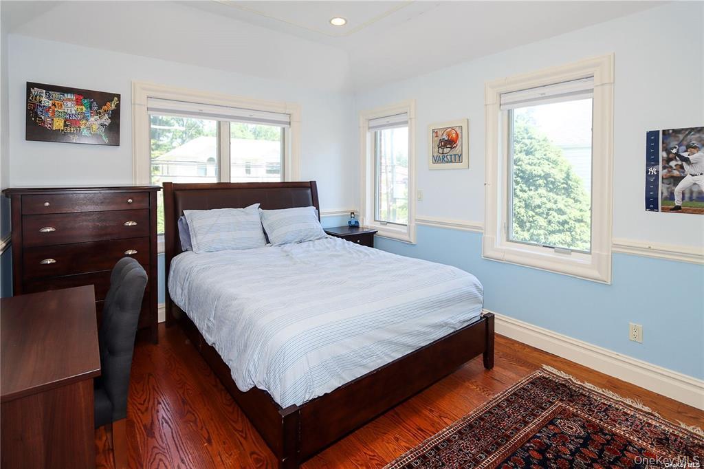 24 Steamboat Road Great Neck, NY 11024 - Photo 22 of 28 Bedroom with wood finished floors and recessed lighting