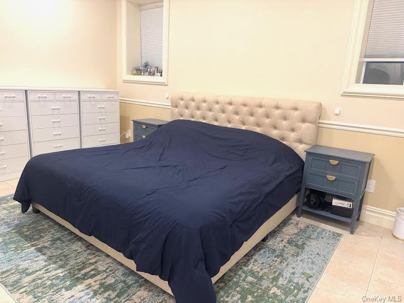 24 Steamboat Road Great Neck, NY 11024 - Photo 24 of 28 Tiled bedroom with baseboards