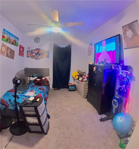 a bedroom with a bed and a couch