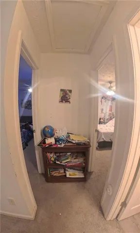 a bedroom with a bed and a ceiling fan