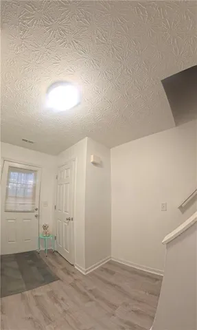 an empty room with a empty space and windows