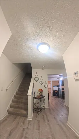 a view of a livingroom with furniture and furniture