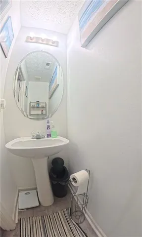 a bathroom with a toilet and a mirror