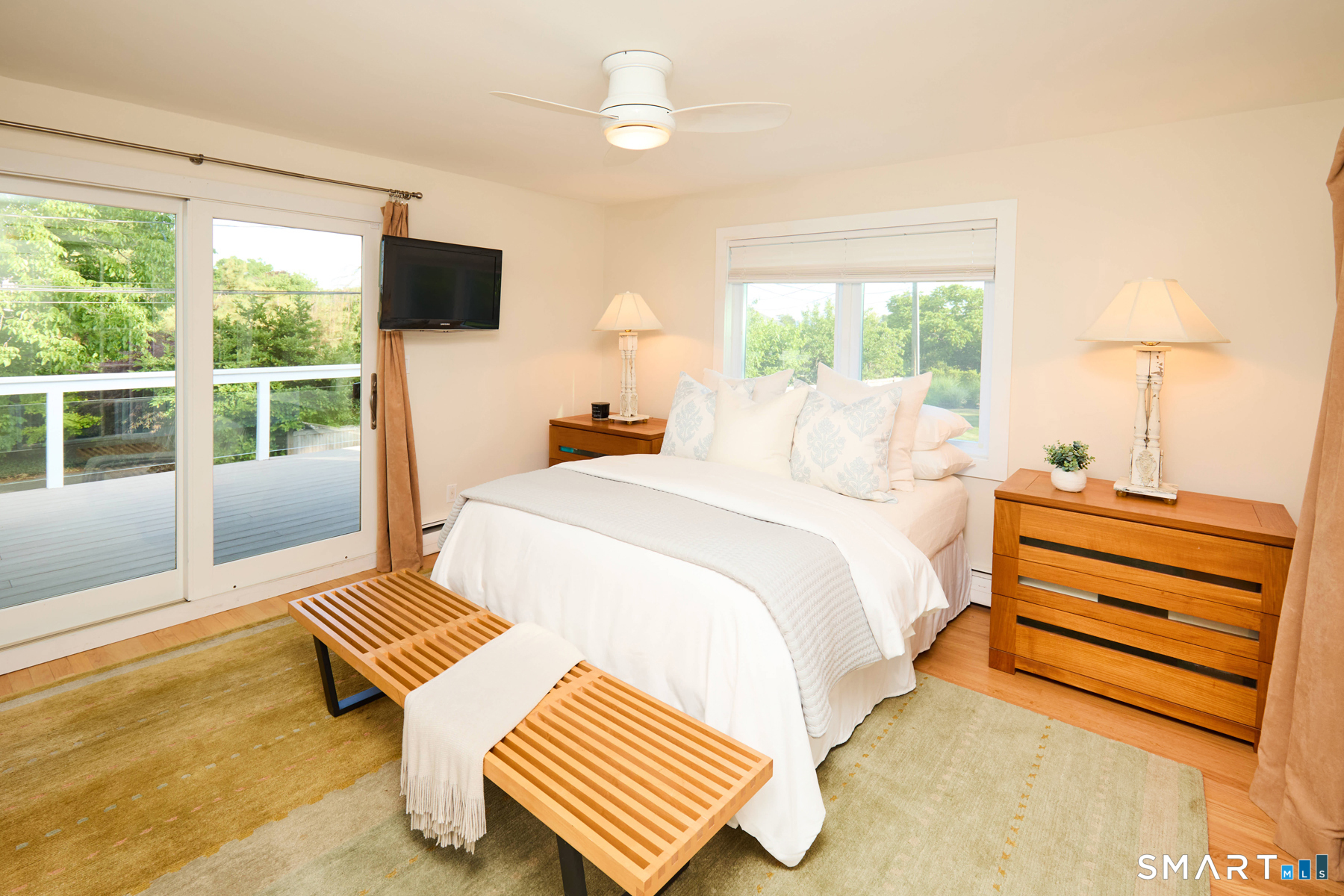 16 Harbor Road Westport, CT 06880 - Photo 22 of 36 a bedroom with a bed and wooden floor