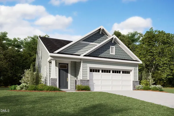 a view of an house with backyard space and garden