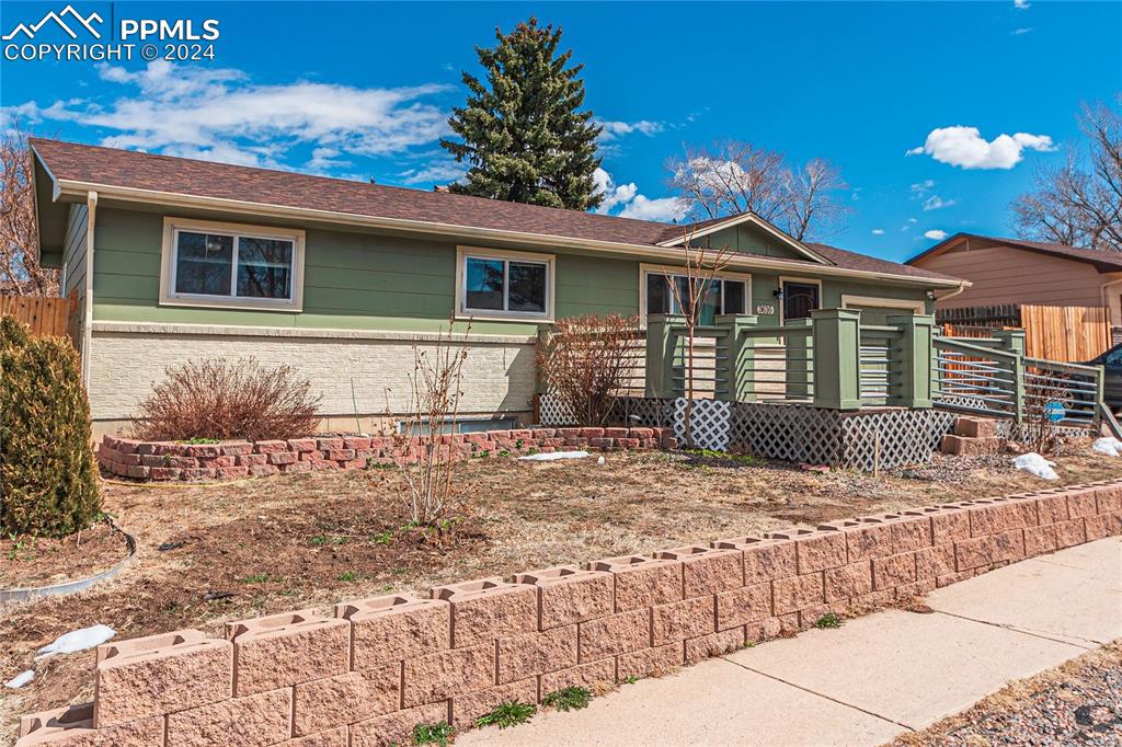 3616 Fairmont Place Colorado Springs, CO 80910 - Photo 1 of 50 a front view of a house with a yard