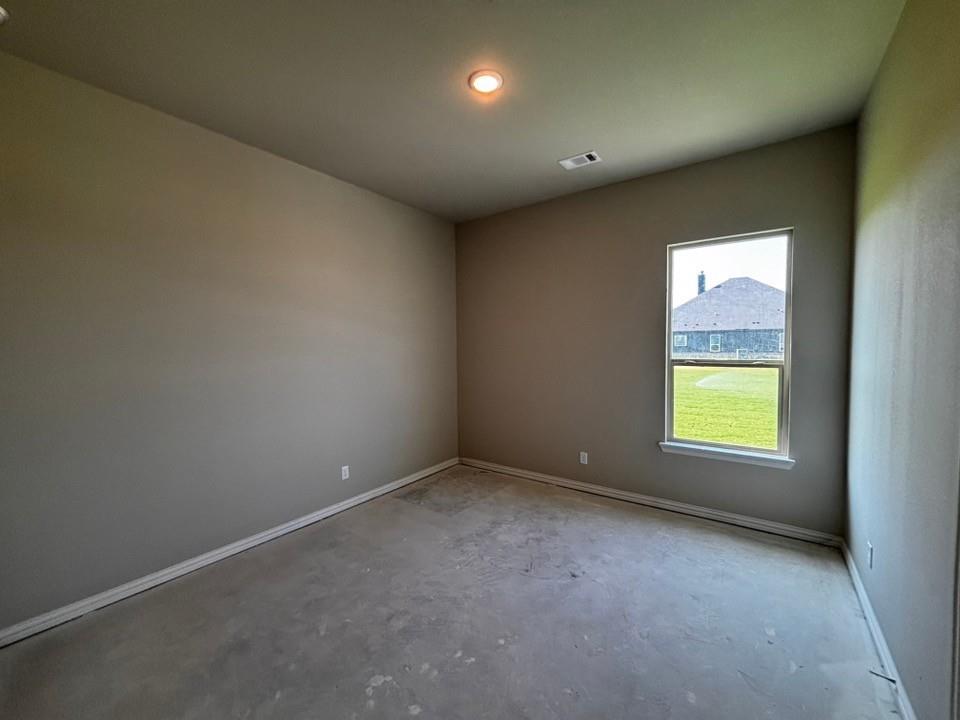 157 Big Sky Road Decatur, TX 76234 - Photo 11 of 13 Vaulted ceiling with recessed lighting, single-pane window, and light gray wall finish