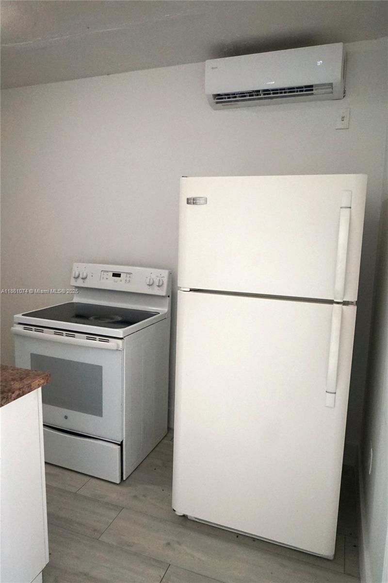 584 Northwest 65th Street, Unit 11 Miami, FL 33150 - Photo 7 of 8 a utility room with dryer and washer