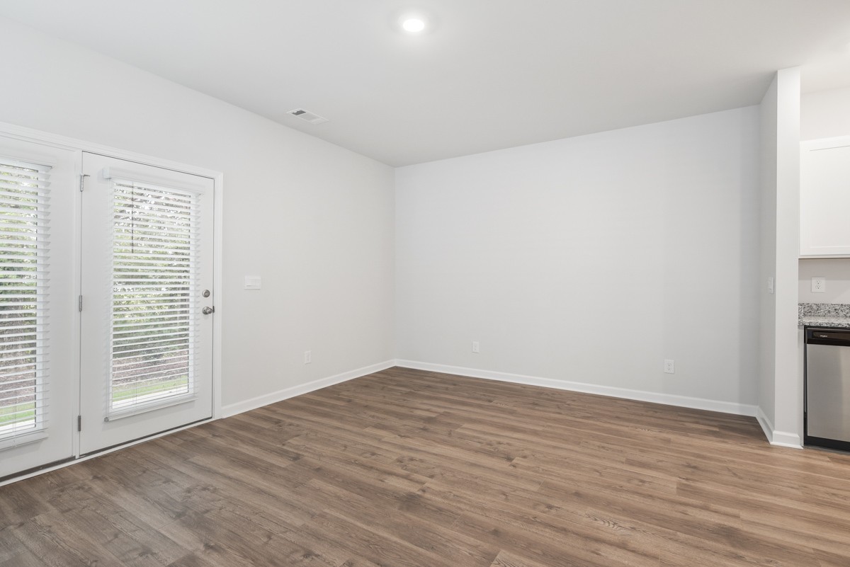 118 Cecil Road Lebanon, TN 37087 - Photo 13 of 36 an empty room with wooden floor and windows