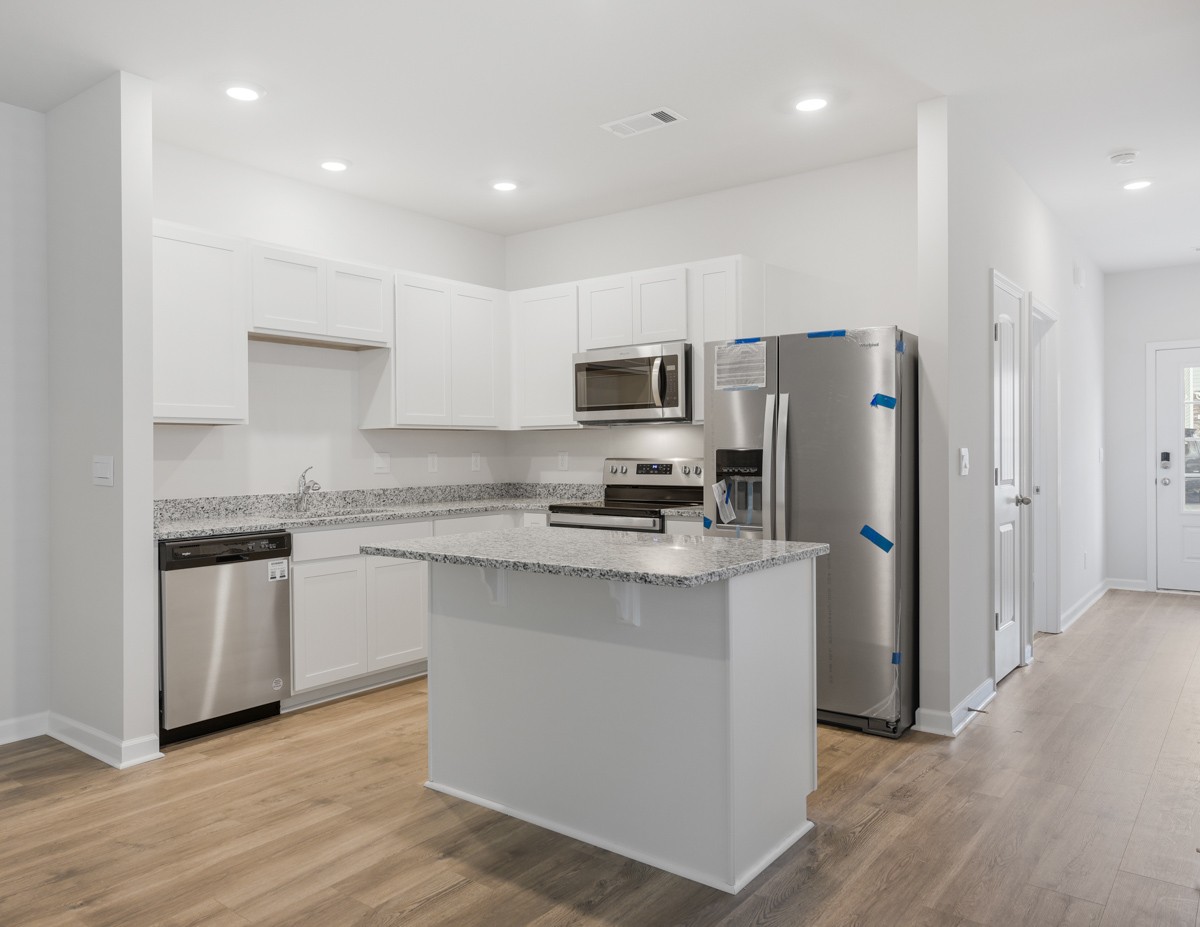 118 Cecil Road Lebanon, TN 37087 - Photo 17 of 36 a kitchen with stainless steel appliances granite countertop a refrigerator stove microwave and sink