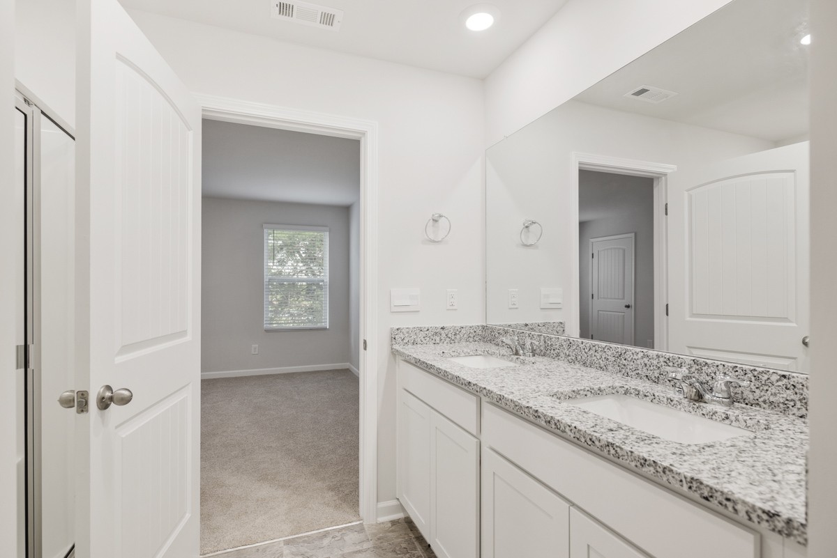 118 Cecil Road Lebanon, TN 37087 - Photo 24 of 36 a bathroom with a granite countertop sink and a mirror