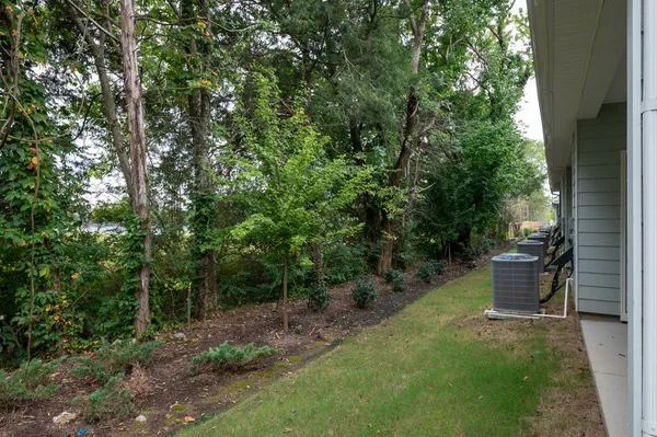 a view of a backyard with patio