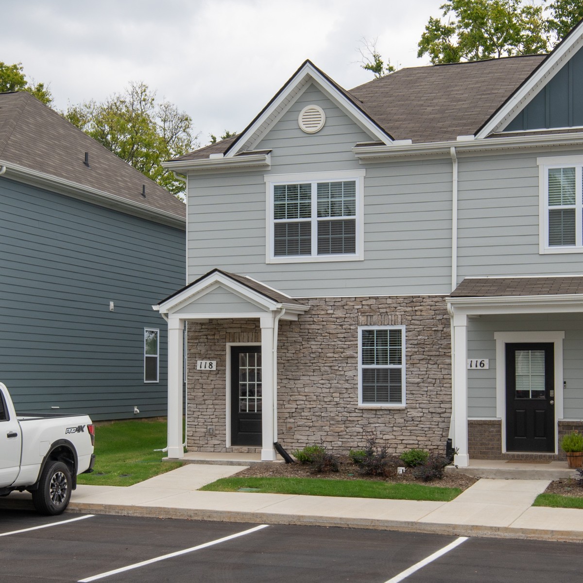 118 Cecil Road Lebanon, TN 37087 - Photo 4 of 36 a front view of a house with a garden and garage