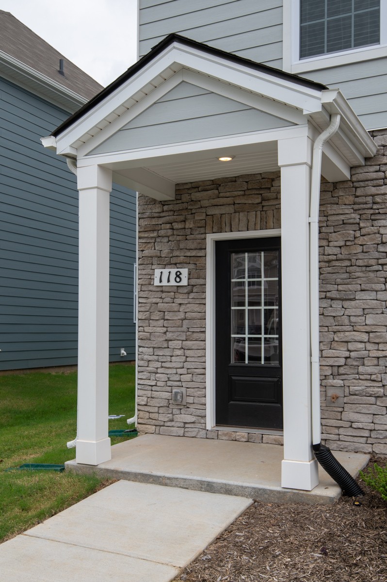 118 Cecil Road Lebanon, TN 37087 - Photo 7 of 36 a front view of a house with a yard and garage