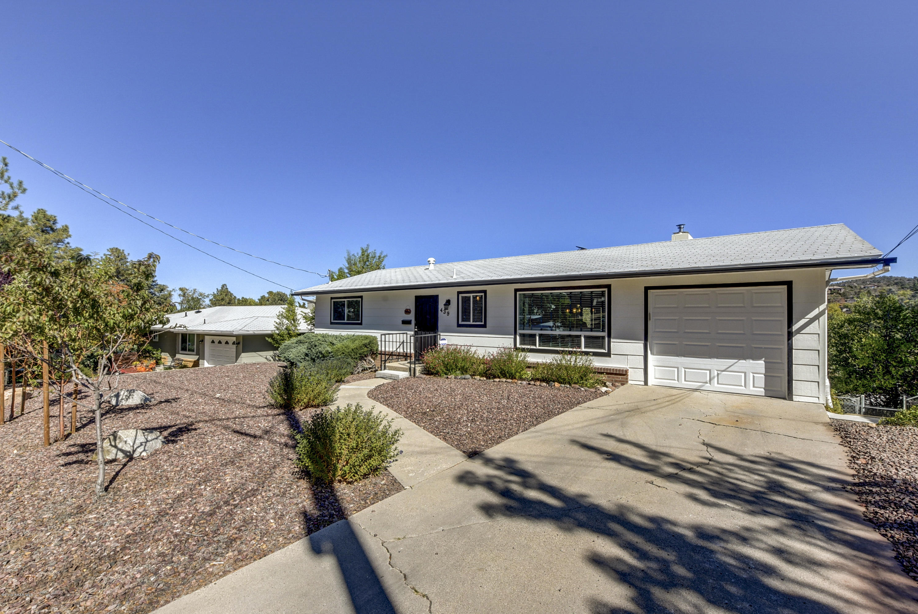 439 Canyon Springs Road Prescott, AZ 86303 - Photo 2 of 37 a front view of a house with garden
