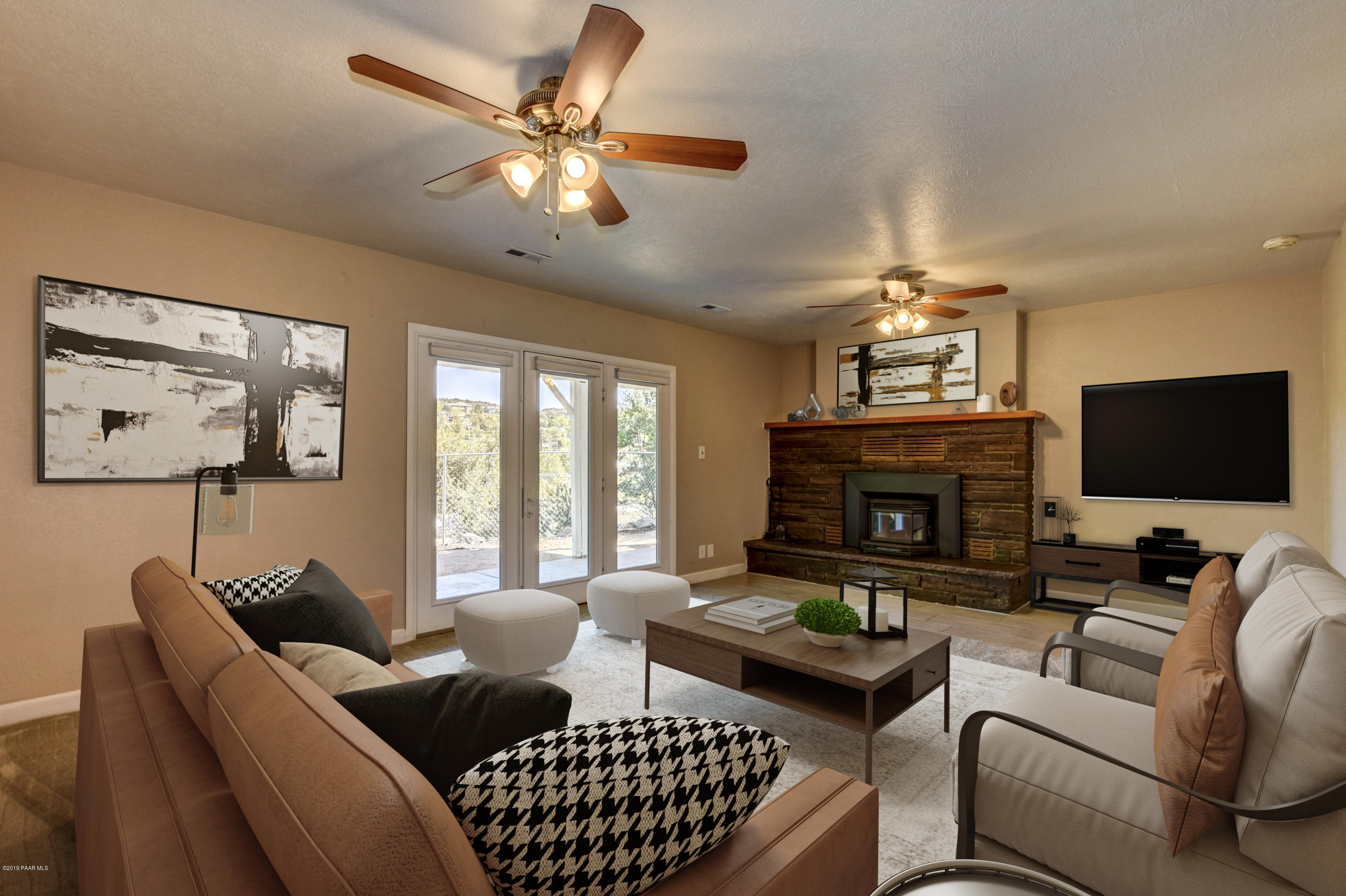 439 Canyon Springs Road Prescott, AZ 86303 - Photo 22 of 37 a living room with furniture a fireplace and a flat screen tv
