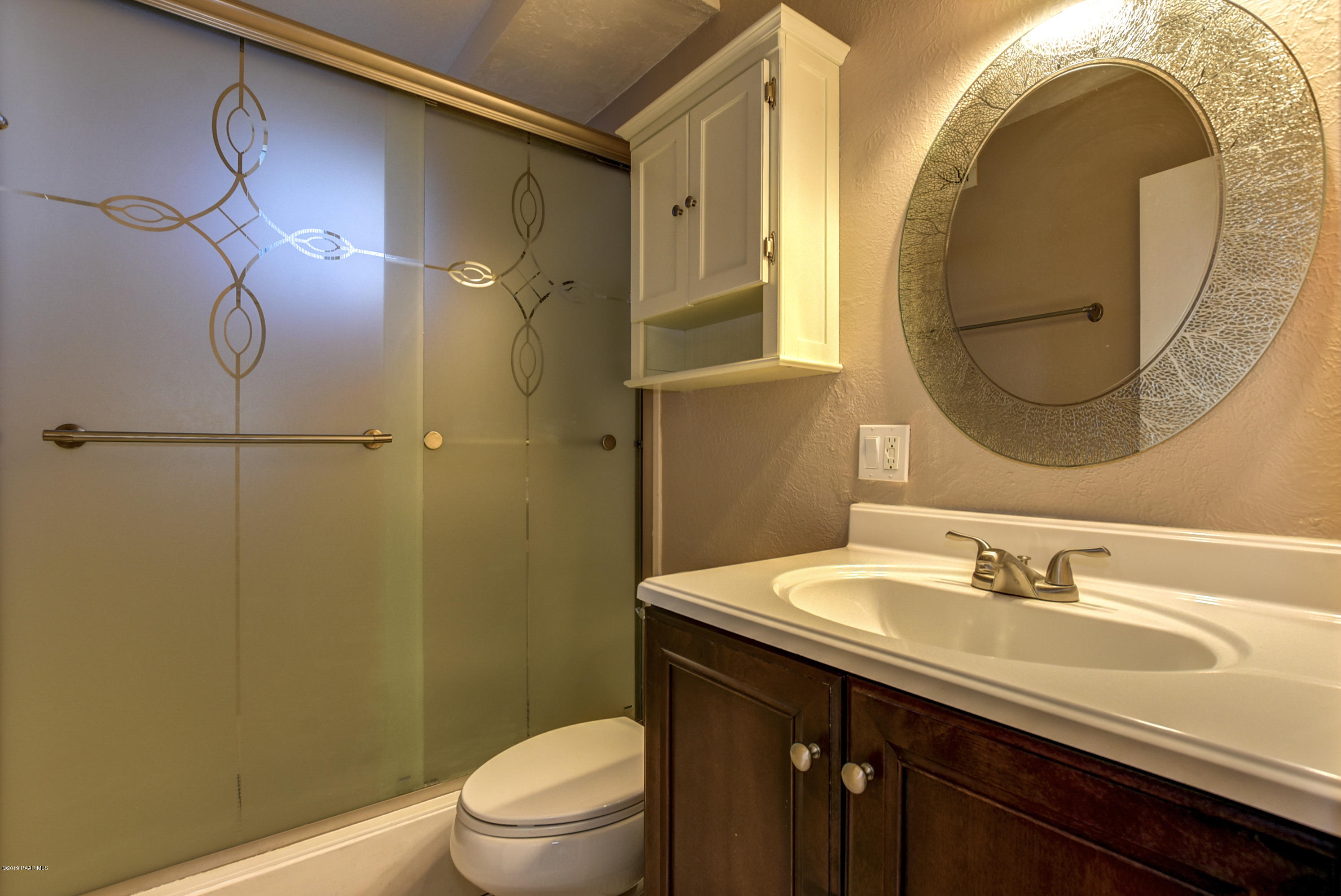 439 Canyon Springs Road Prescott, AZ 86303 - Photo 28 of 37 a bathroom with a sink and a mirror