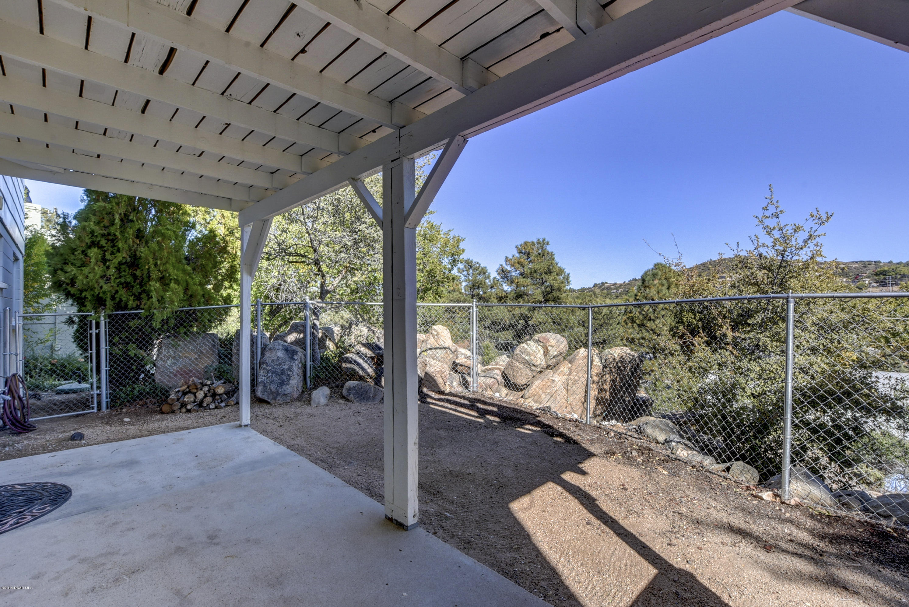 439 Canyon Springs Road Prescott, AZ 86303 - Photo 31 of 37 a view of a couches chair and tables in patio