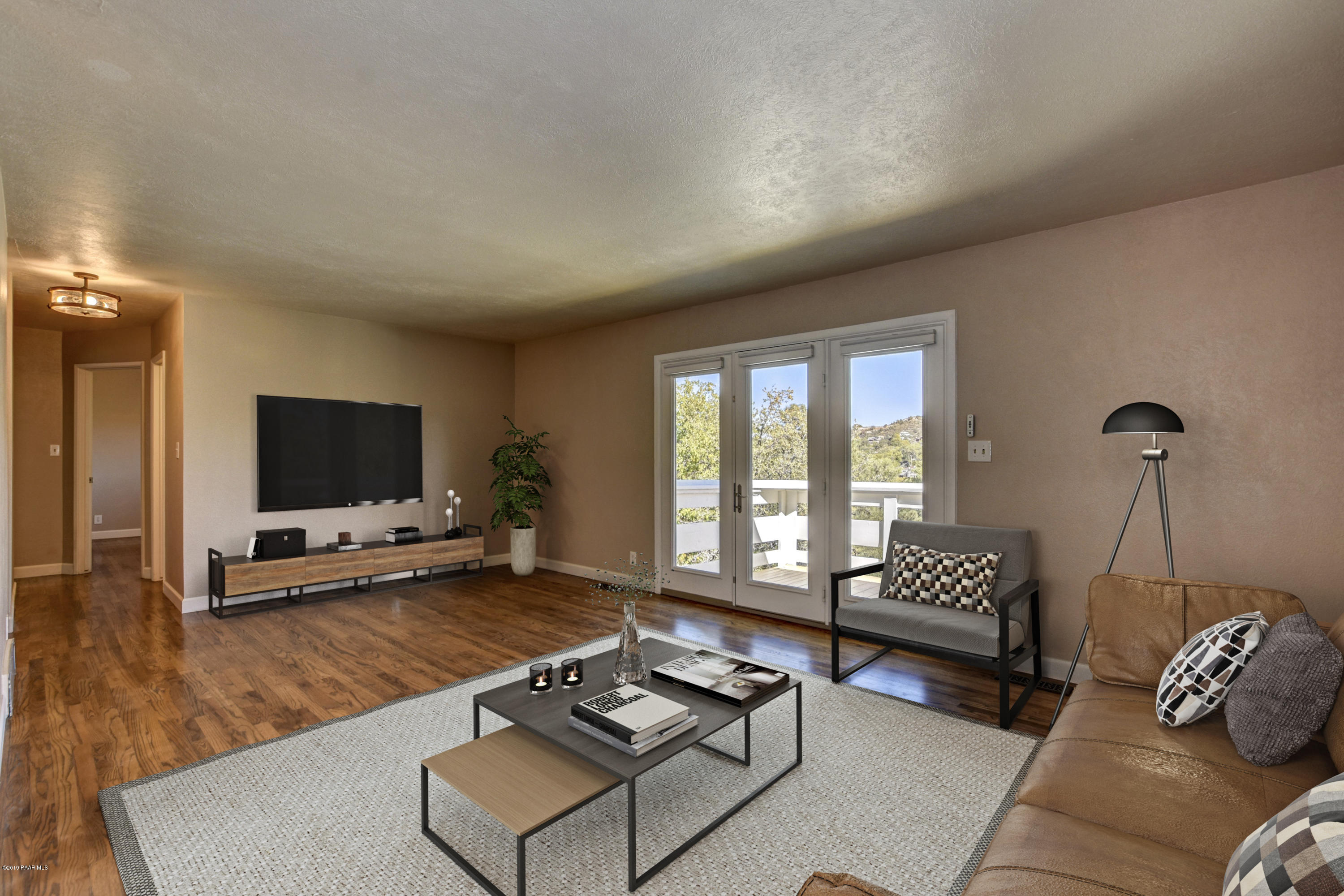 439 Canyon Springs Road Prescott, AZ 86303 - Photo 6 of 37 a living room with furniture and a flat screen tv