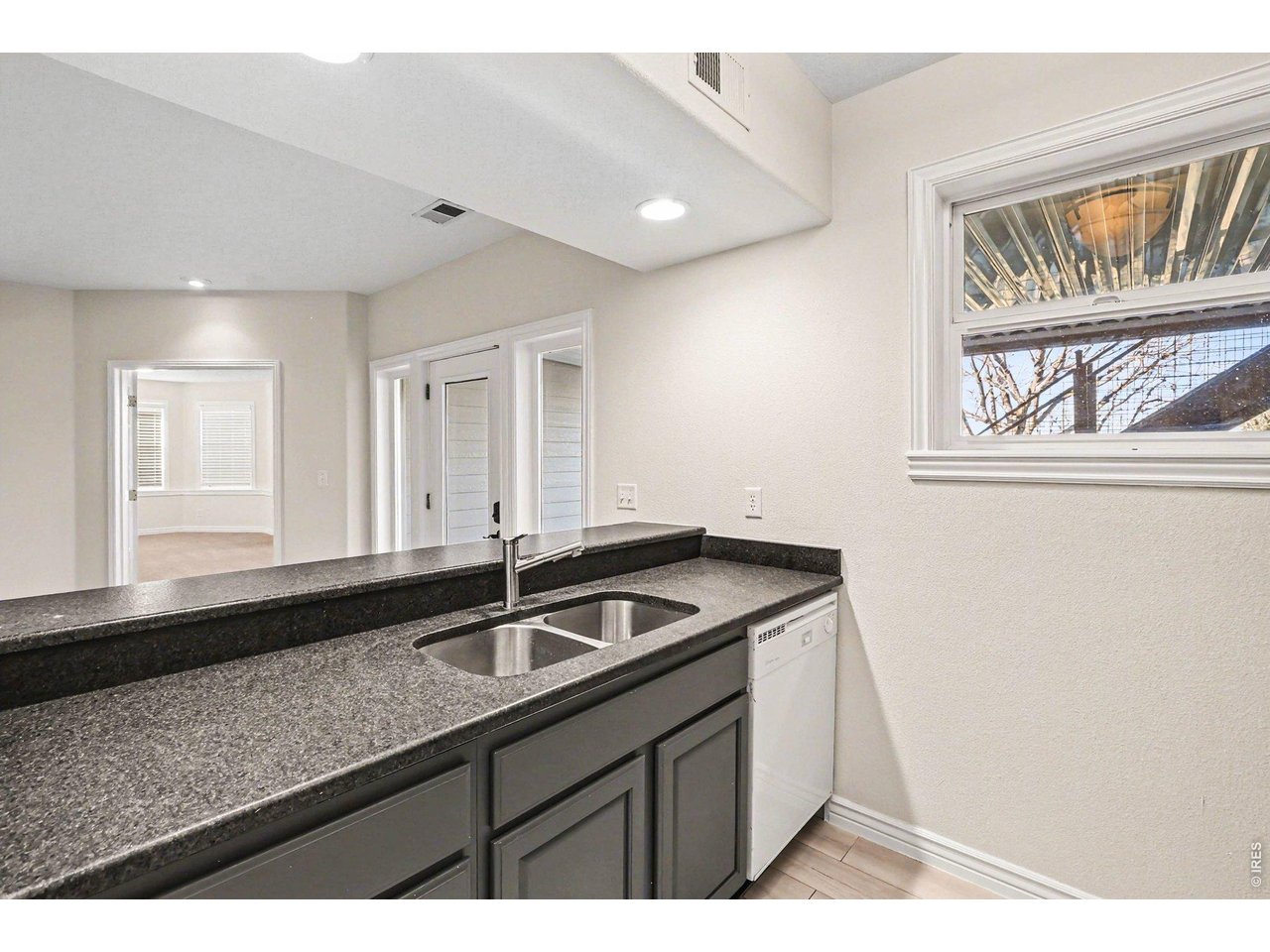 1049 Ridge W Drive Windsor, CO 80550 - Photo 29 of 46 Wet Bar/Kitchenette in Walkout Basement