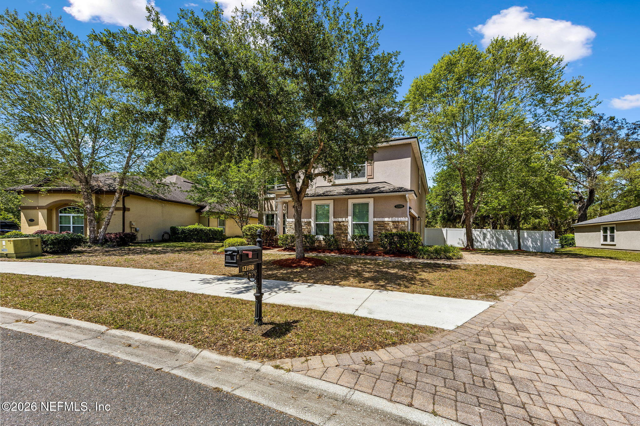 12198 Ridge Crossing Way Jacksonville, FL 32226 - Photo 3 of 67 a front view of a house with a yard and tree