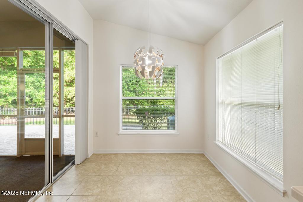 9080 Sweet Tree Trail Jacksonville, FL 32256 - Photo 14 of 44 a view of an empty room with a window