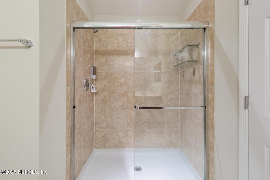 9080 Sweet Tree Trail Jacksonville, FL 32256 - Photo 17 of 44 a bathroom with a shower