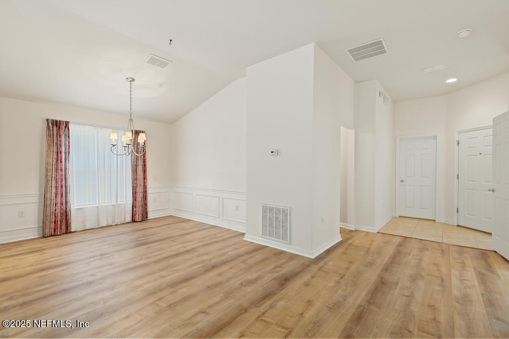 9080 Sweet Tree Trail Jacksonville, FL 32256 - Photo 19 of 44 a view of a room with wooden floor