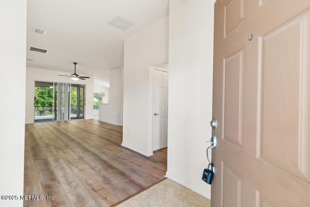 9080 Sweet Tree Trail Jacksonville, FL 32256 - Photo 2 of 44 a view of entryway with wooden floor