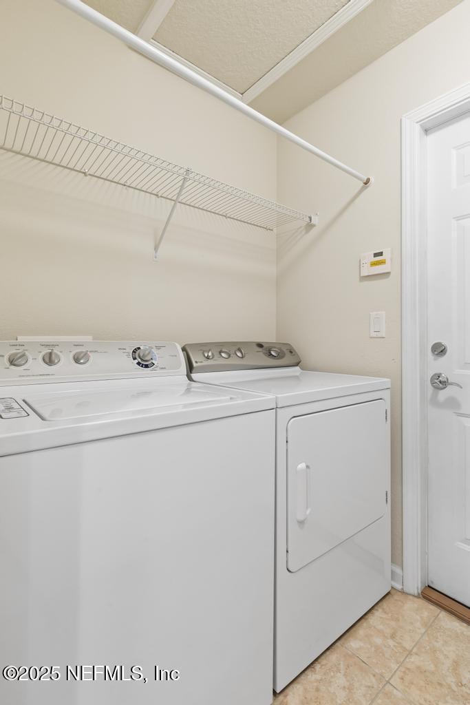 9080 Sweet Tree Trail Jacksonville, FL 32256 - Photo 35 of 44 a utility room with dryer and washer