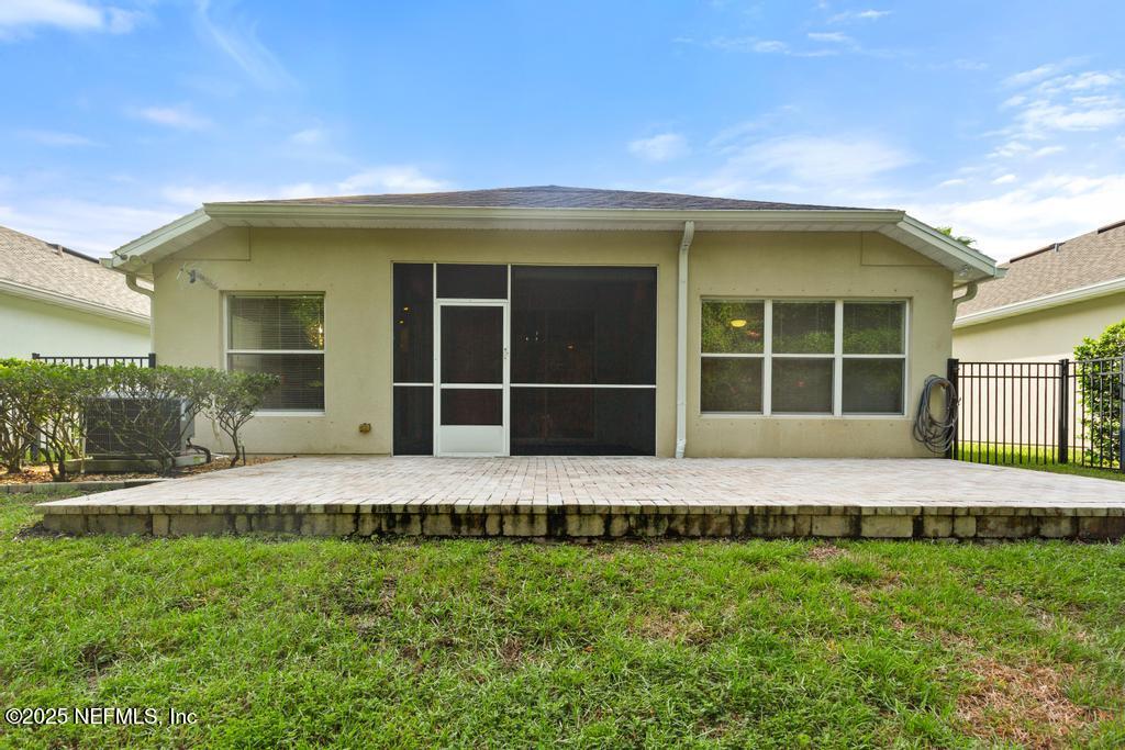 9080 Sweet Tree Trail Jacksonville, FL 32256 - Photo 41 of 44 a view of a house with a yard and large tree