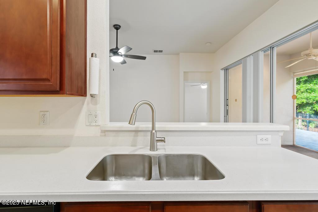 9080 Sweet Tree Trail Jacksonville, FL 32256 - Photo 9 of 44 a close view of sink and tap