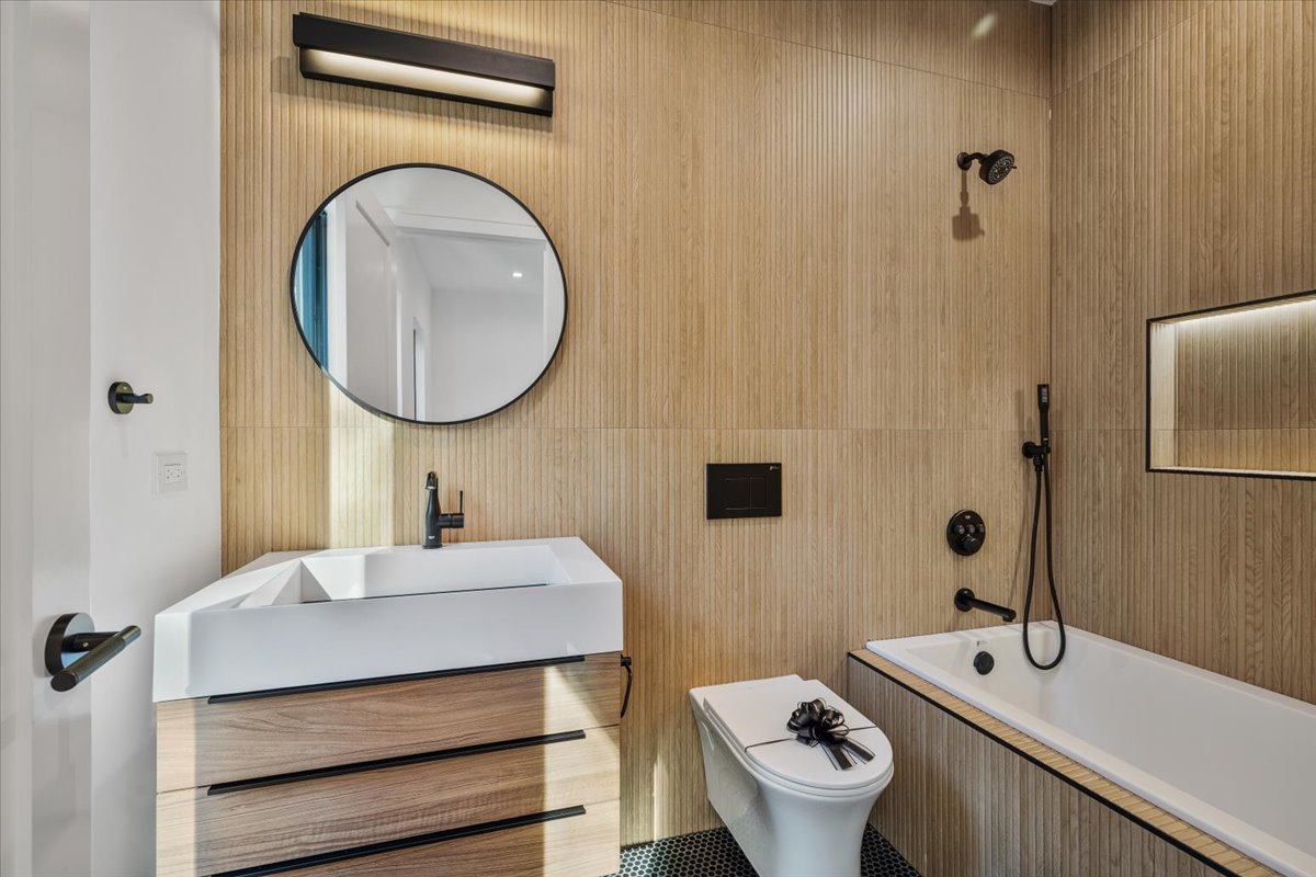 849 Sheridan Road Wilmette, IL 60091 - Photo 38 of 73 a bathroom with a sink mirror and toilet