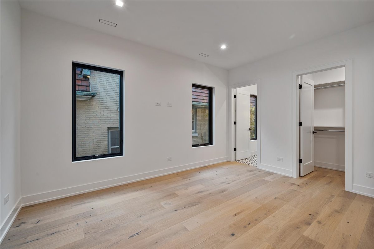 849 Sheridan Road Wilmette, IL 60091 - Photo 39 of 73 a view of an empty room with wooden floor and a window