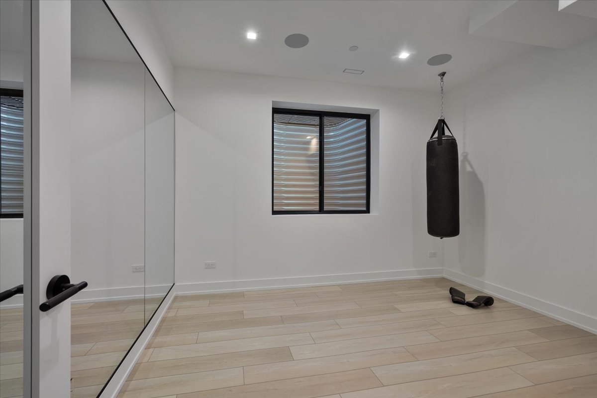 849 Sheridan Road Wilmette, IL 60091 - Photo 53 of 73 a view of a room with wooden floor and windows