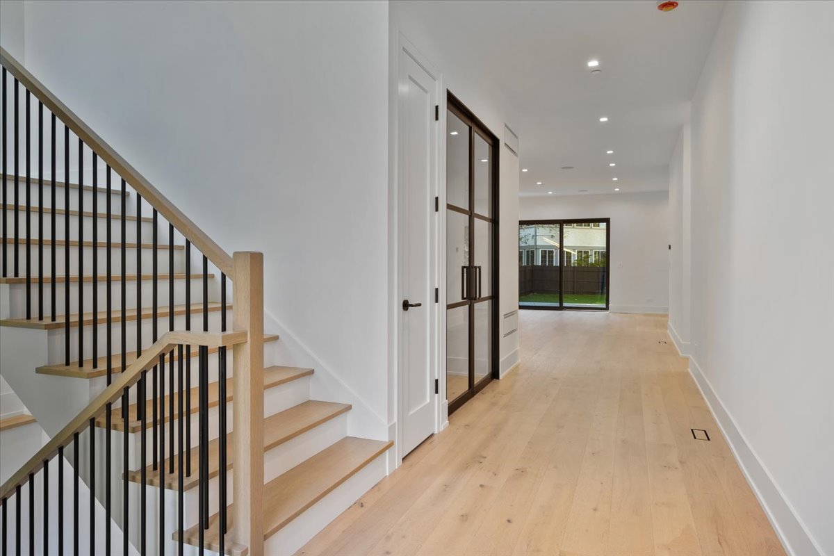 849 Sheridan Road Wilmette, IL 60091 - Photo 6 of 73 a view of a hallway with wooden floor and entryway