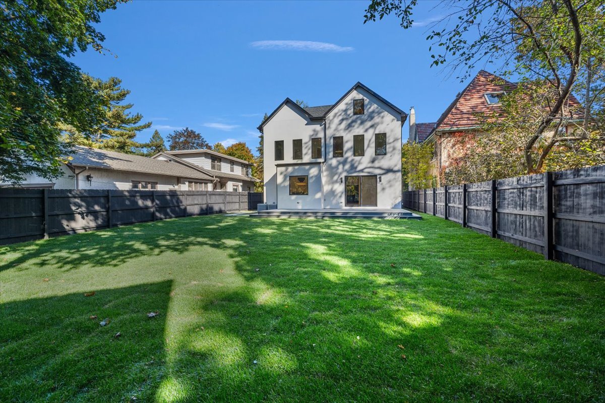 849 Sheridan Road Wilmette, IL 60091 - Photo 63 of 73 a view of a house with a big yard and large trees