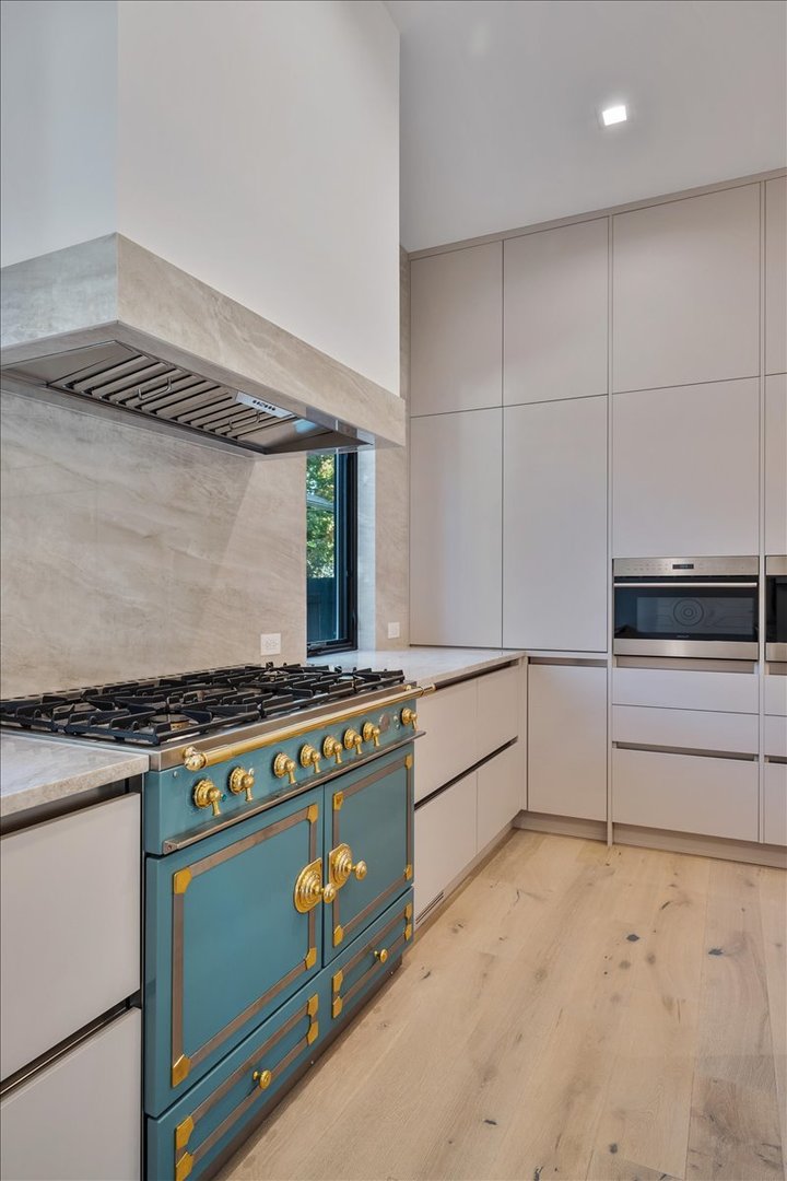 849 Sheridan Road Wilmette, IL 60091 - Photo 8 of 73 a kitchen with stainless steel appliances granite countertop a stove and a refrigerator