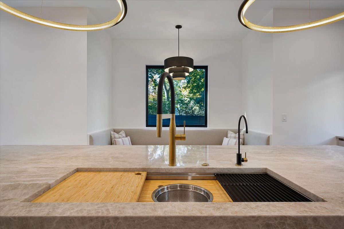 849 Sheridan Road Wilmette, IL 60091 - Photo 9 of 73 a kitchen with a table chairs and a chandelier