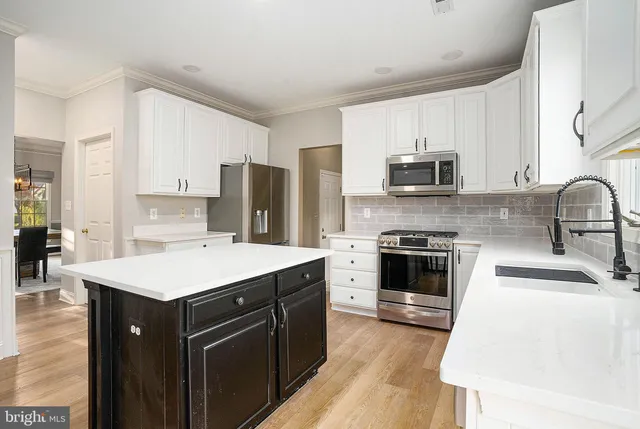 an aerial view of multiple houses with yard