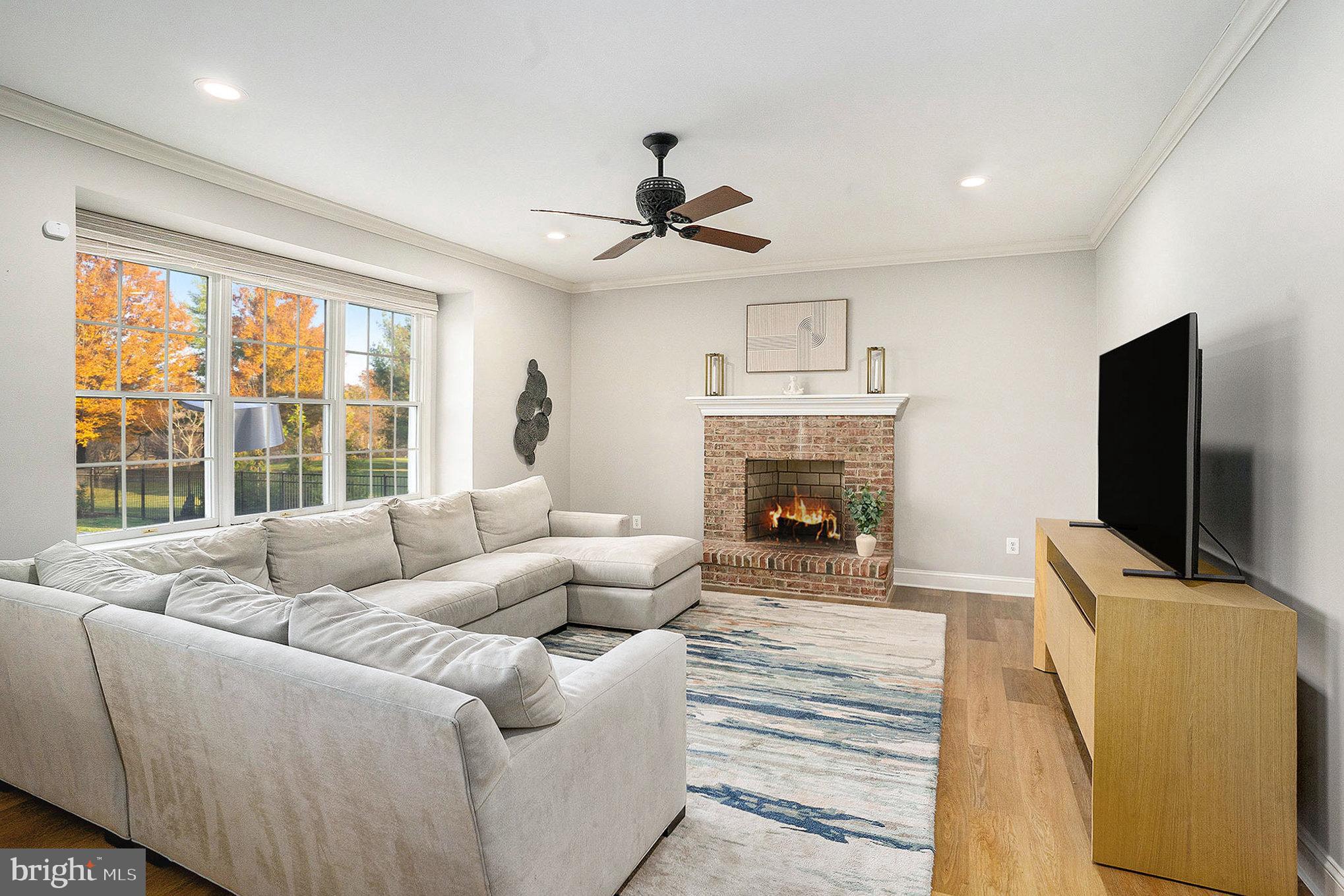 127 Spyglass Drive Blue Bell, PA 19422 - Photo 15 of 74 a living room with furniture large window and a flat screen tv