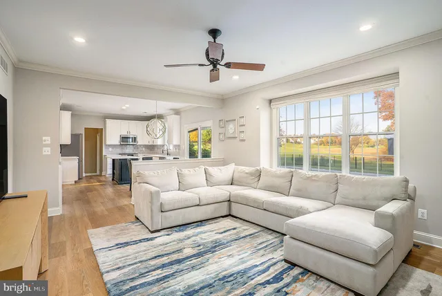 an aerial view of a house with a yard and lake view