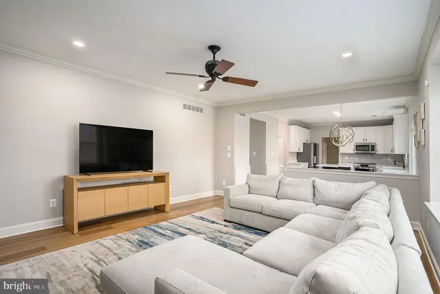 a view of a swimming pool with a flower garden