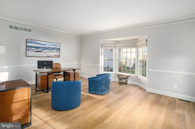 an aerial view of residential houses with outdoor space and river