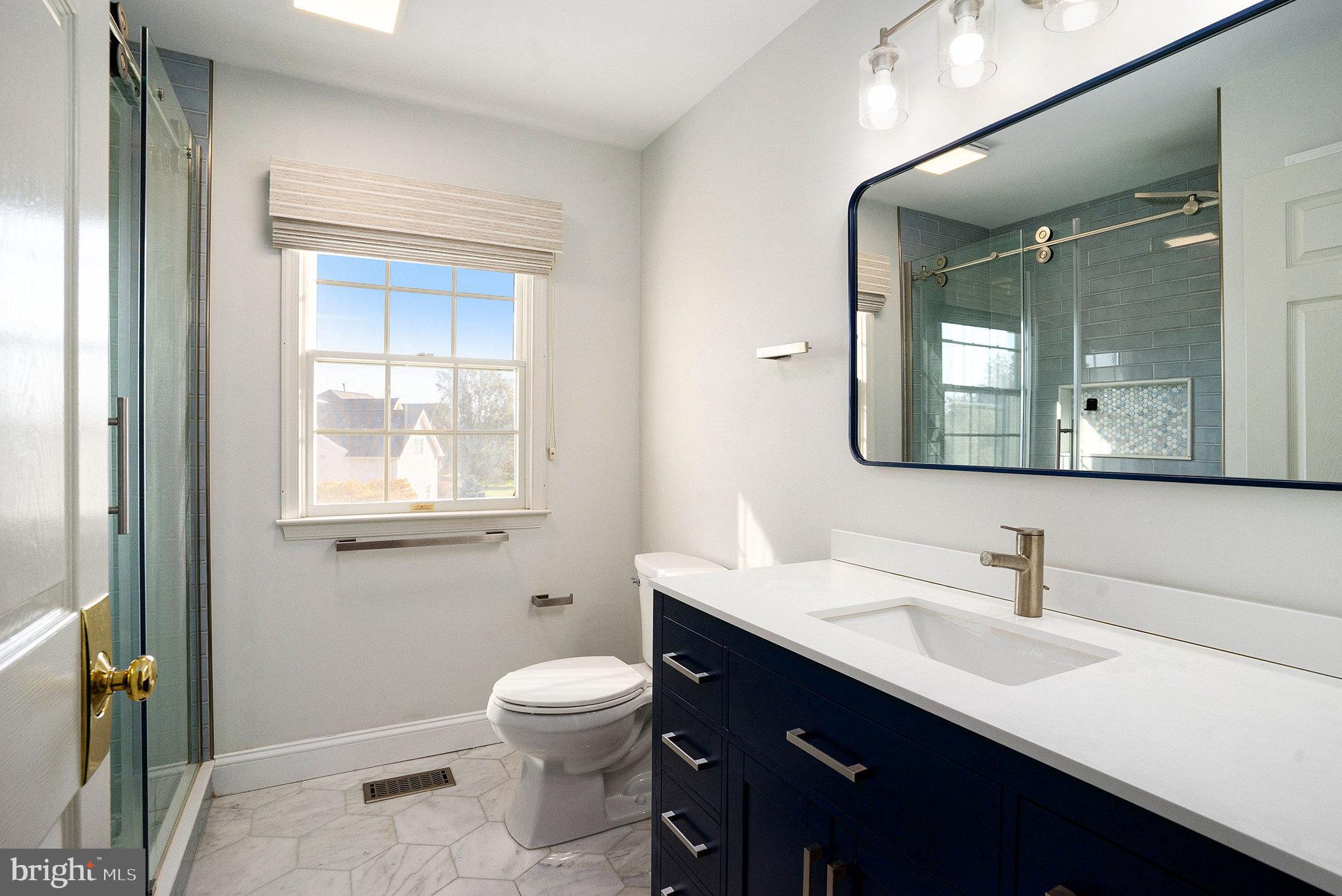 127 Spyglass Drive Blue Bell, PA 19422 - Photo 30 of 74 a bathroom with a toilet sink double vanity and mirror
