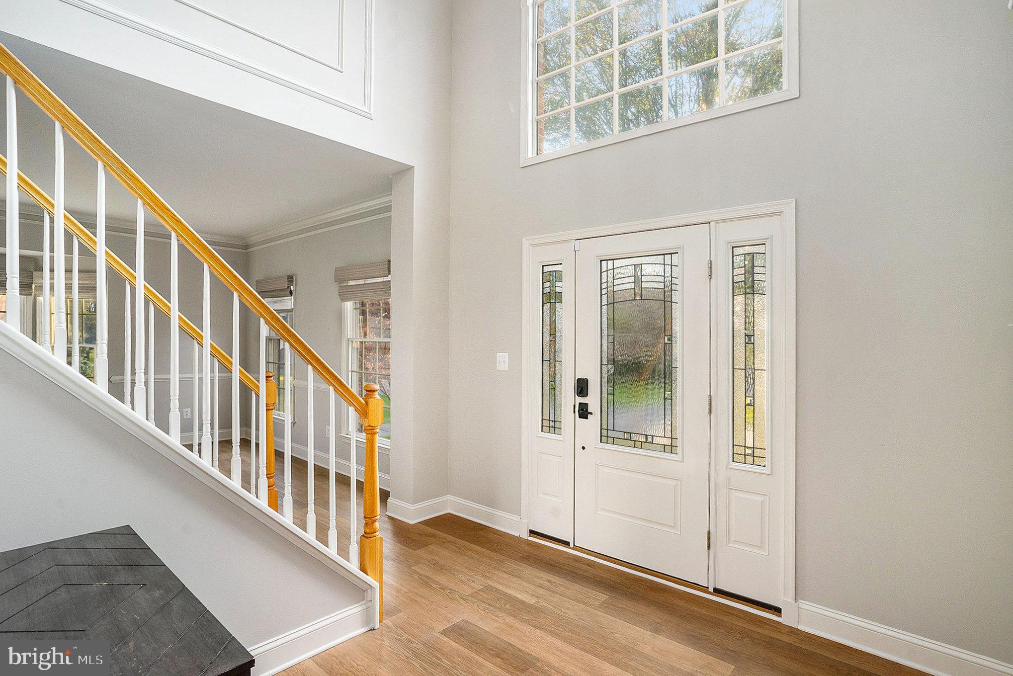 127 Spyglass Drive Blue Bell, PA 19422 - Photo 4 of 74 a view of an entryway with wooden floor and windows