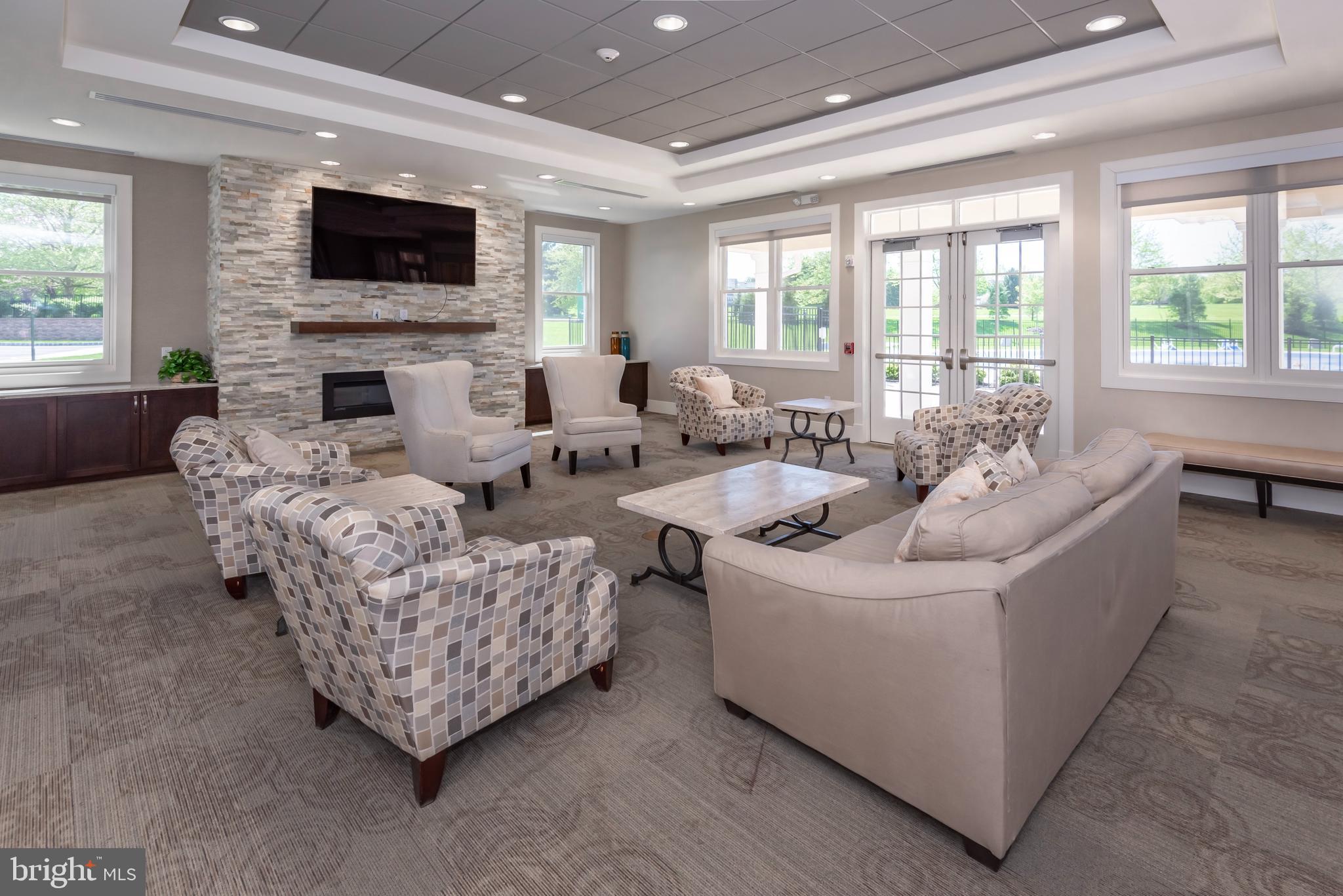 127 Spyglass Drive Blue Bell, PA 19422 - Photo 72 of 74 a living room with furniture a flat screen tv and a fireplace